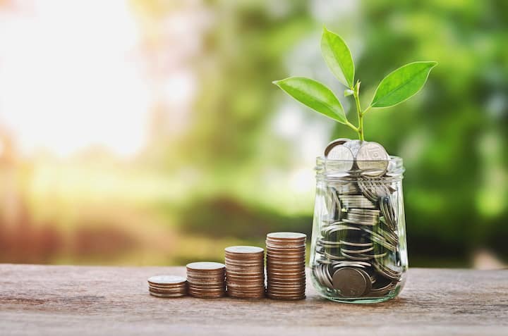 Plant,Growing,On,Coins,Glass,Jar,And,Concept,Money,Saving in Portland